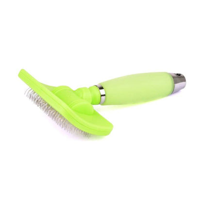 Green silicone pet grooming slicker brush with metal bristles and soft handle