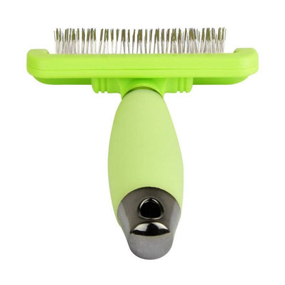Front view of green silicone pet grooming brush with metal bristles and grip handle